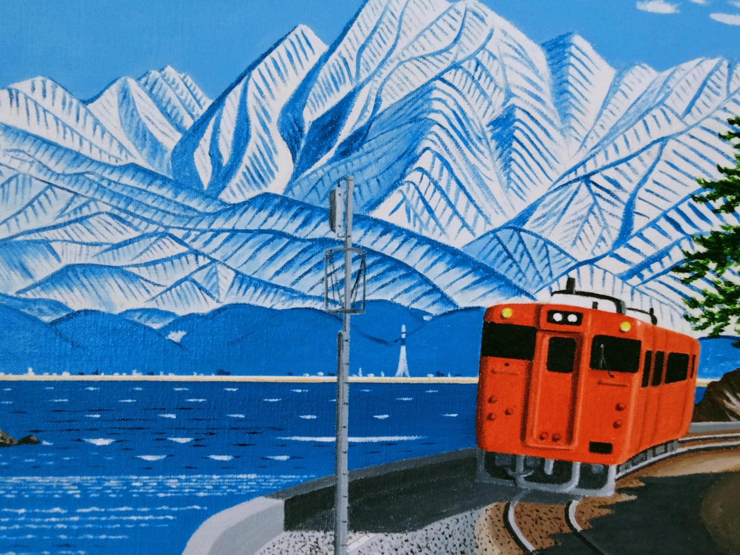 雨晴れ海岸を走る電車